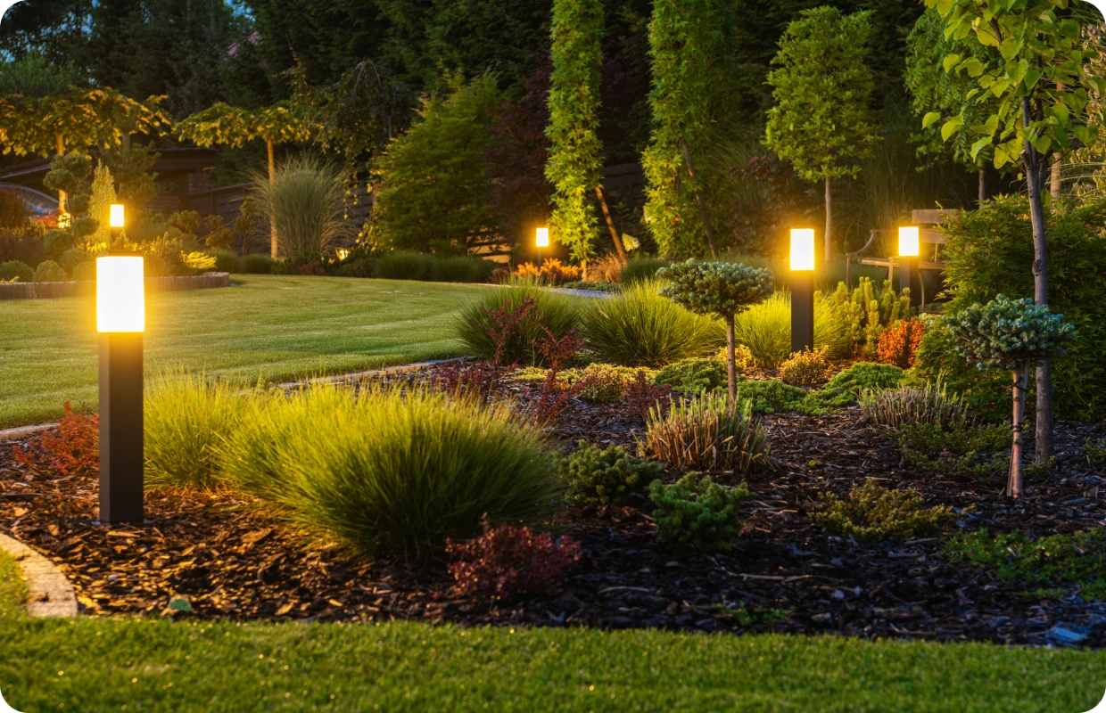 Evening garden scene with bright pathway lights