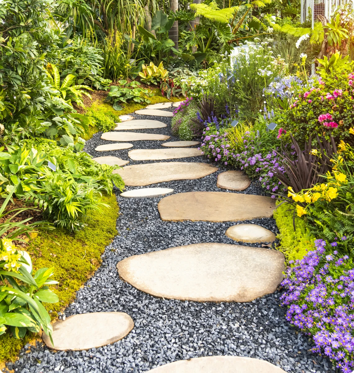 Stone pathway through vibrant garden