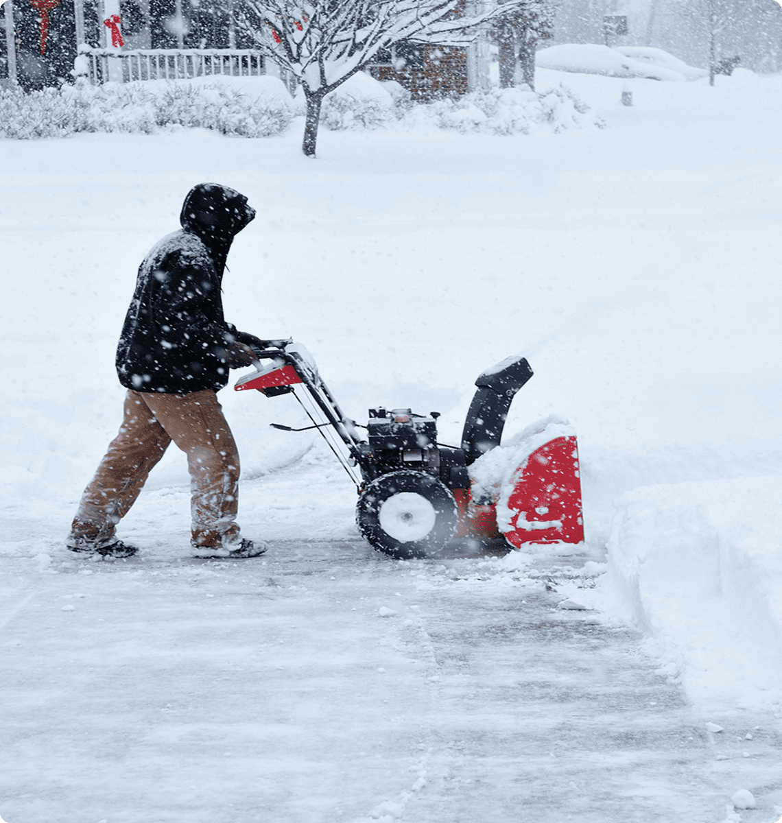 Clearing snow with a snow blower